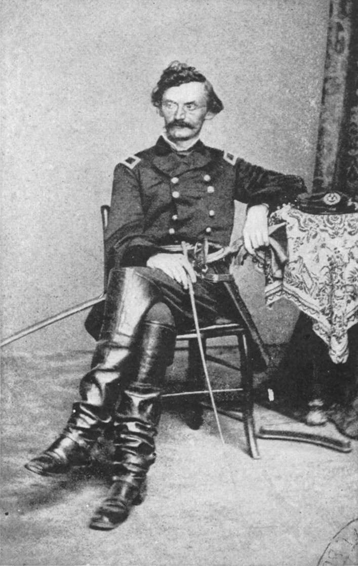 Black-and-white photograph of Carl Schurz at the time he entered the federal army as a brigadier general (American Civil War). He is seated , in uniform, with his legs crossed and arm resting on a table at his side.