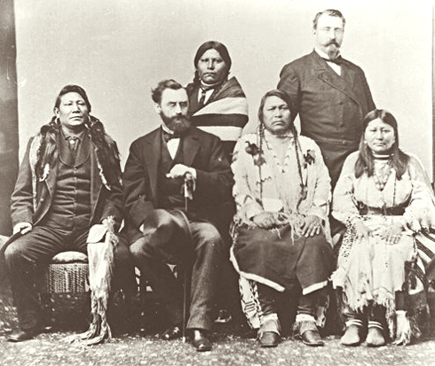 In 1880, Chief Ouray and other Utes traveled to Washington. D.C. to negotiate a treaty that would result in the removal of the White River and Tabeguache Utes from Colorado to the Uintah Basin in present day Utah. Chief Ouray died at age 47 shortly after this trip. Seated from left to right: Chief Ignacio of the Southern Utes, Carl Shurz, Secretary of the Interior, Chief Ouray and his wife, Chipeta. Standing are Woretsiz and General Charles Adams. This photo was shot in Washington, D.C. in 1880 when a delegation of Ute Indians traveled to Washington to negotiate a treaty with the U.S. government.